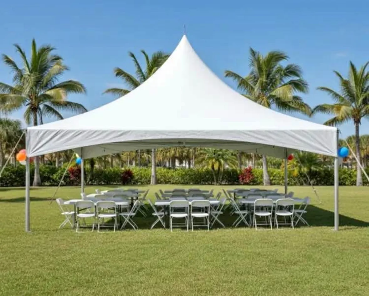 Party tent with tables and chairs set up for a Miami event